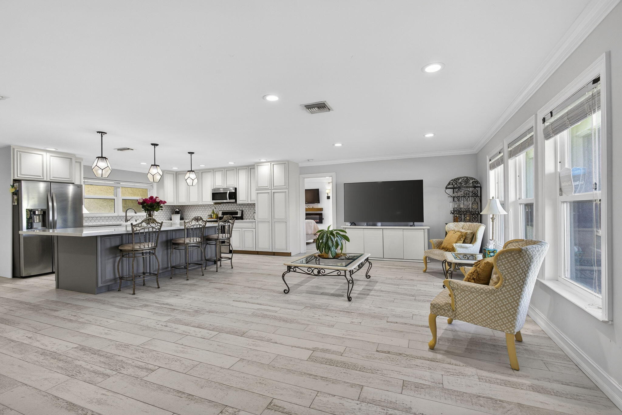 16490 Rustic Road Wellington, FL 33470 - Photo 5 of 81 a living room with furniture and a flat screen tv