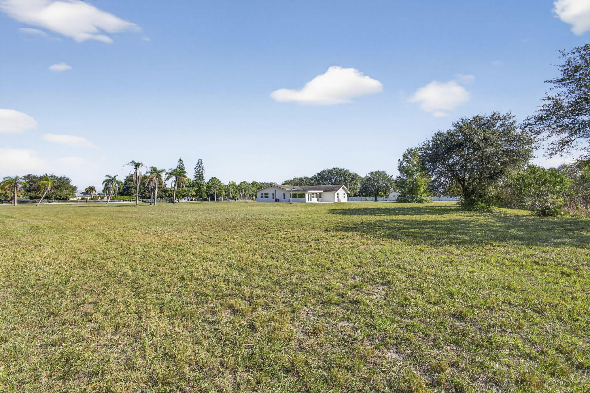 16490 Rustic Road Wellington, FL 33470 - Photo 55 of 81 a view of a lake view