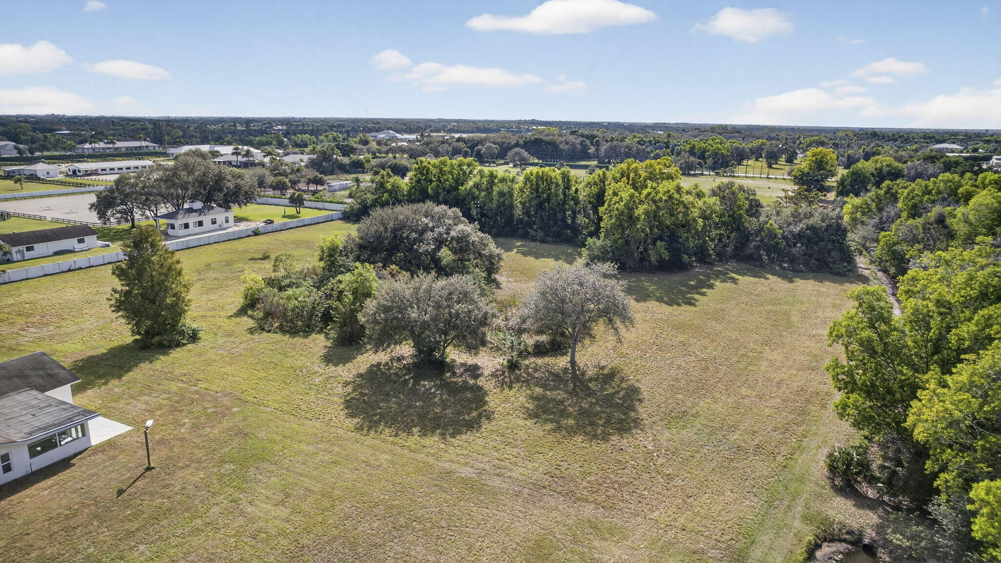 16490 Rustic Road Wellington, FL 33470 - Photo 75 of 81 a view of a city with mountains in the background
