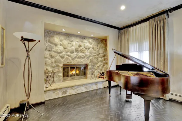 a living room with furniture a flat screen tv and a large window