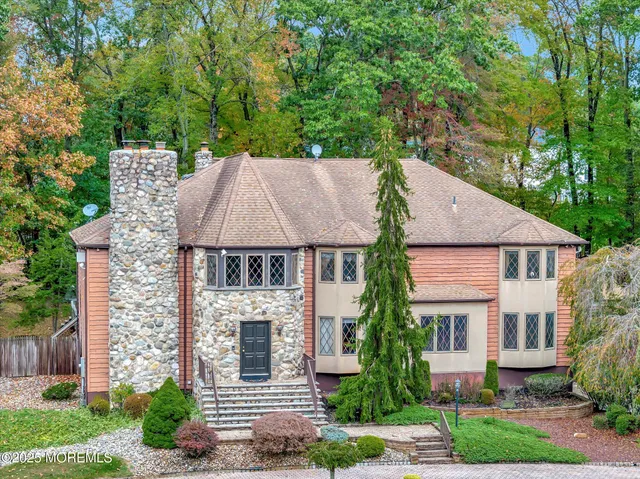a aerial view of a house with a yard and a garden