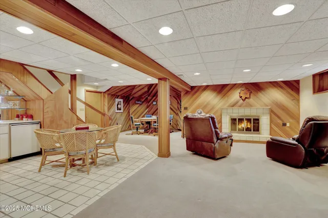 a view of house with backyard and deck