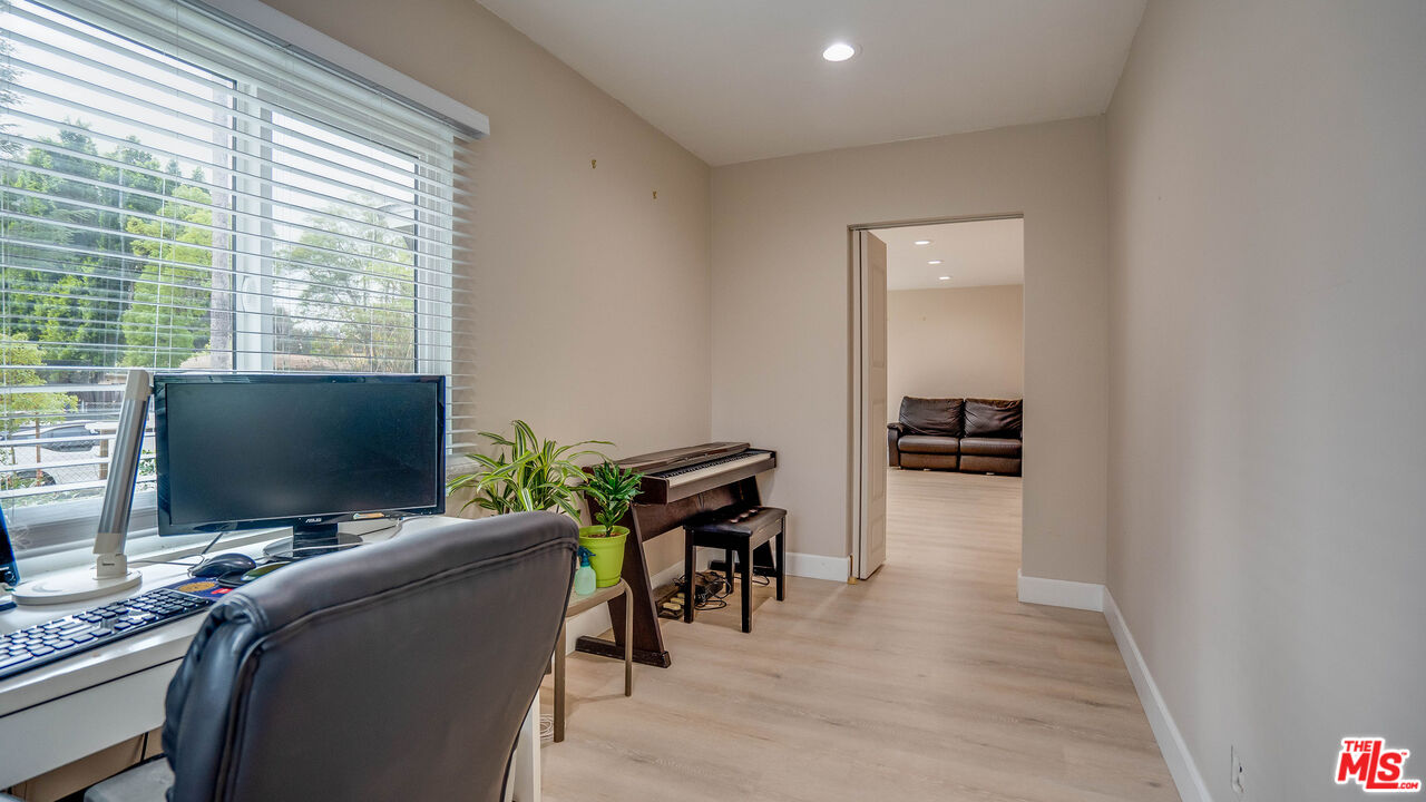 263 Flower Street Pasadena, CA 91104 - Photo 13 of 34 a view of a workspace with furniture and a window
