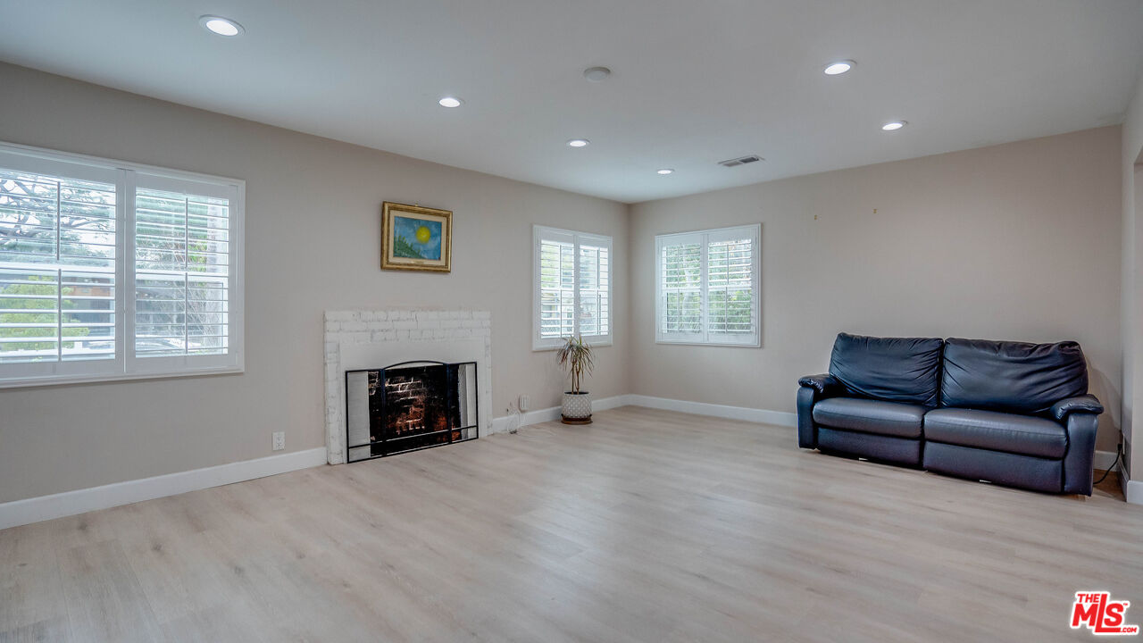 263 Flower Street Pasadena, CA 91104 - Photo 14 of 34 a living room with furniture and a fireplace