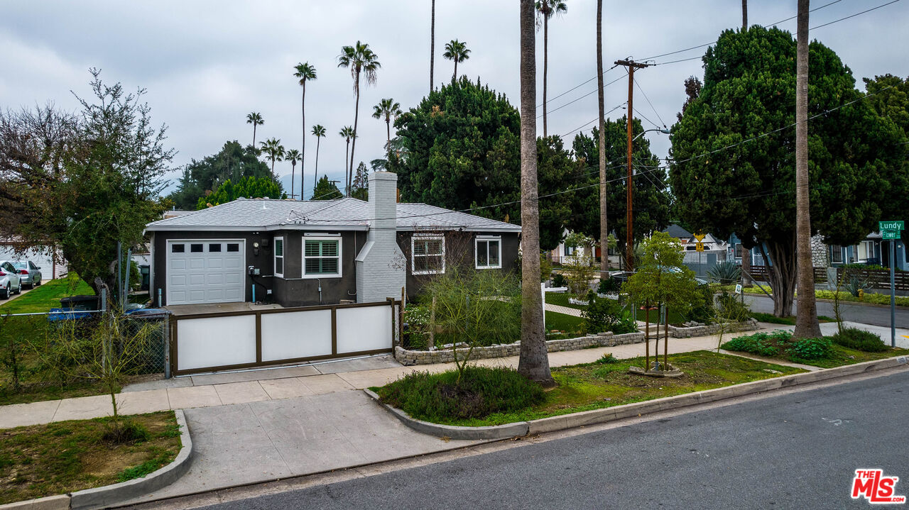 263 Flower Street Pasadena, CA 91104 - Photo 34 of 34 a front view of a house with a yard and garage