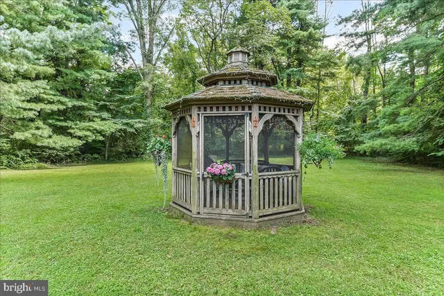 a view of a wooden deck with a yard