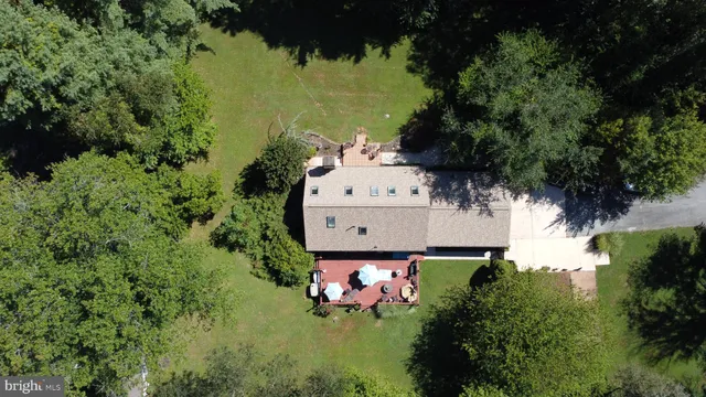 a aerial view of a house with a yard