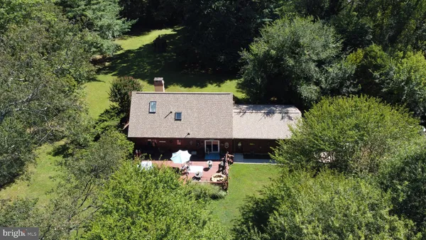 a aerial view of a house with a yard