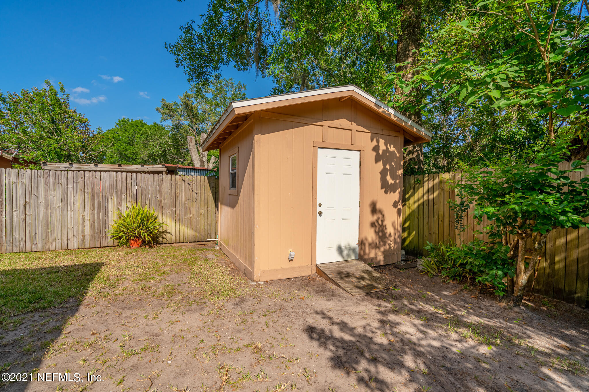 4612 Castleton Drive Jacksonville, FL 32208 - Photo 13 of 41 a view of a small house with pool next to a yard