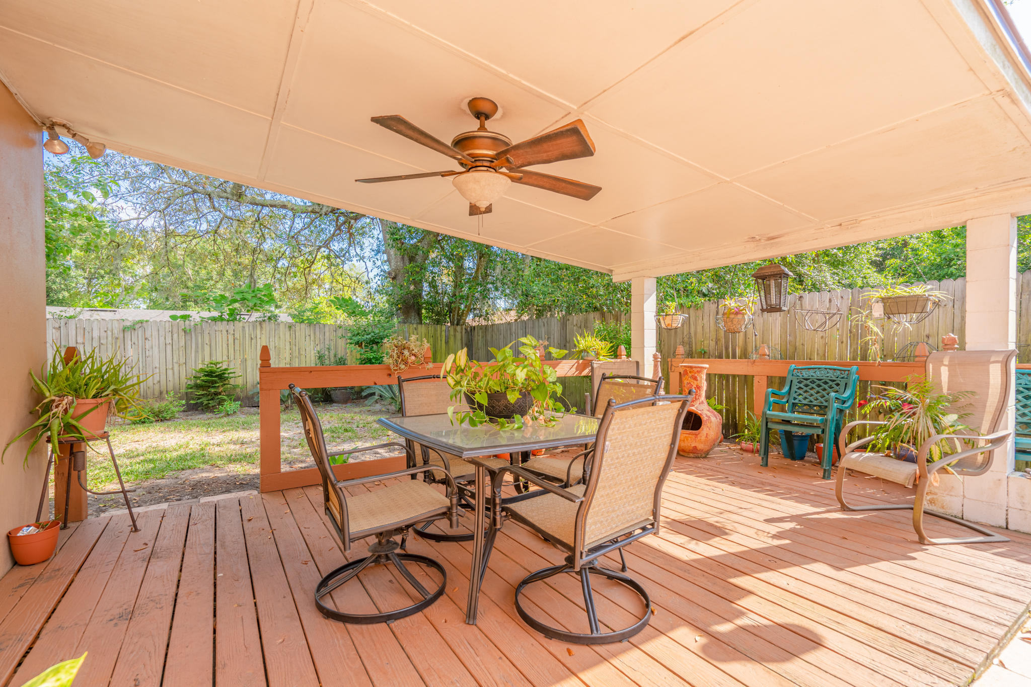 4612 Castleton Drive Jacksonville, FL 32208 - Photo 16 of 41 a view of a patio with a table and chairs