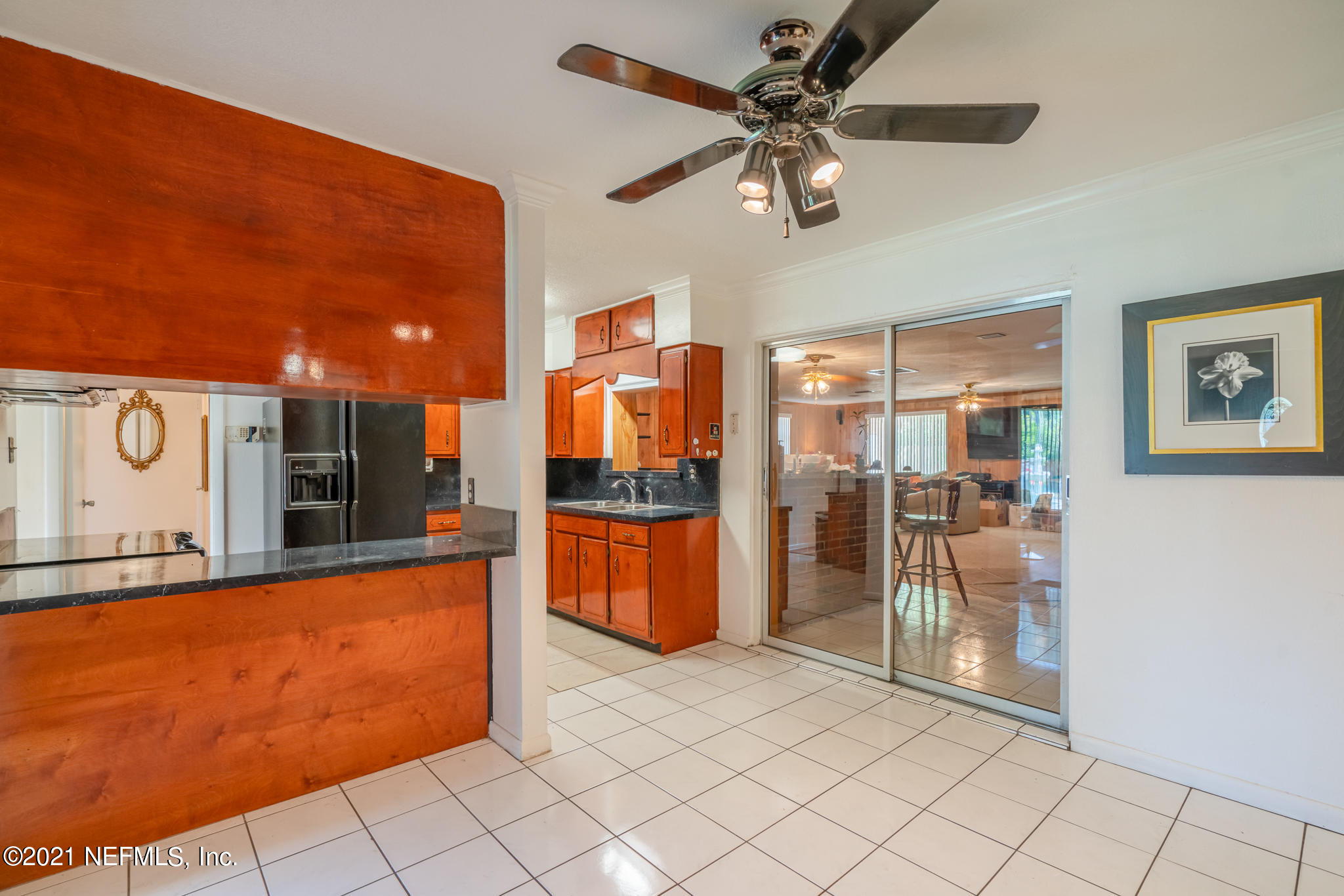 4612 Castleton Drive Jacksonville, FL 32208 - Photo 18 of 41 a view of a kitchen with fridge and workspace