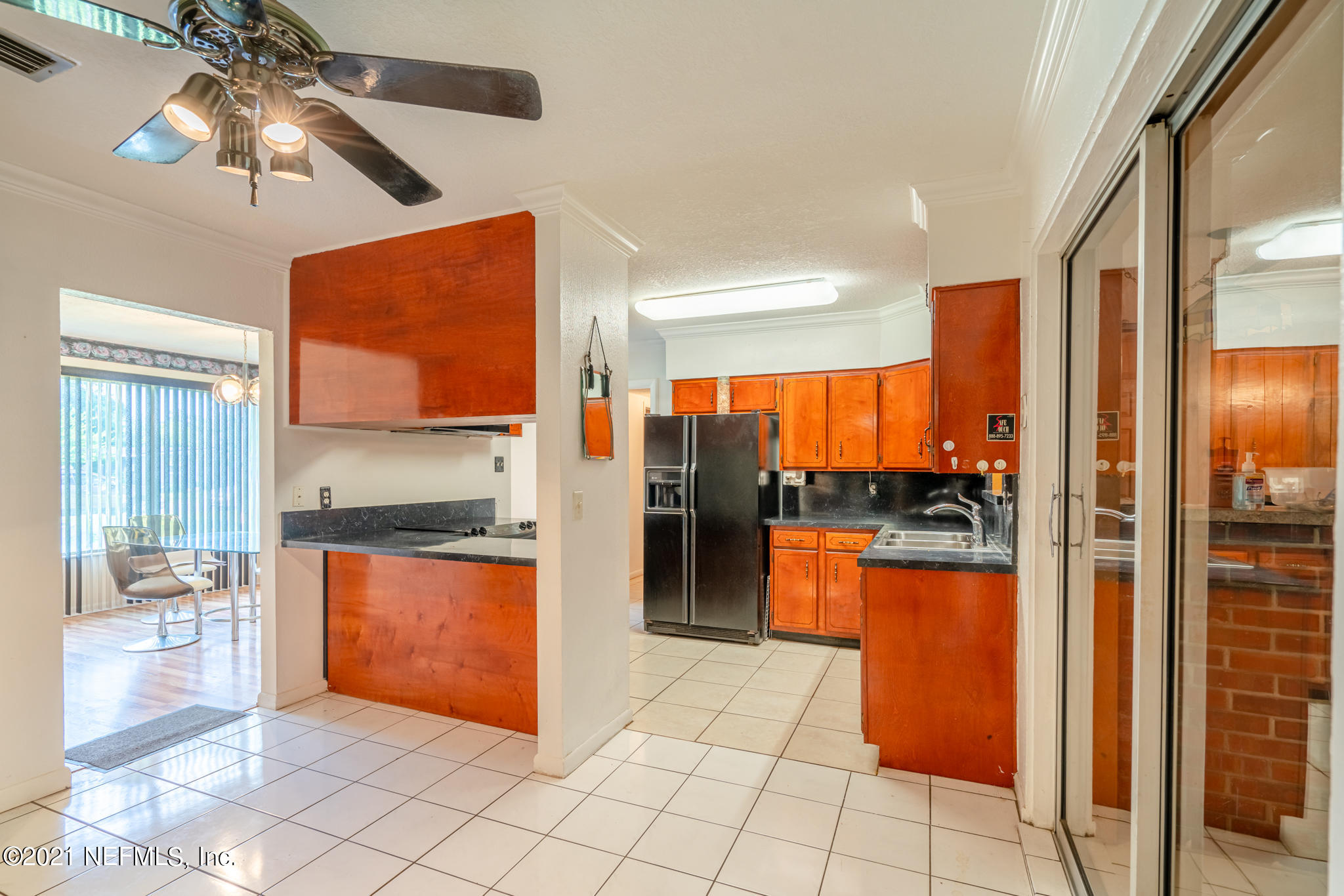 4612 Castleton Drive Jacksonville, FL 32208 - Photo 19 of 41 a kitchen with stainless steel appliances granite countertop a refrigerator a stove and a sink