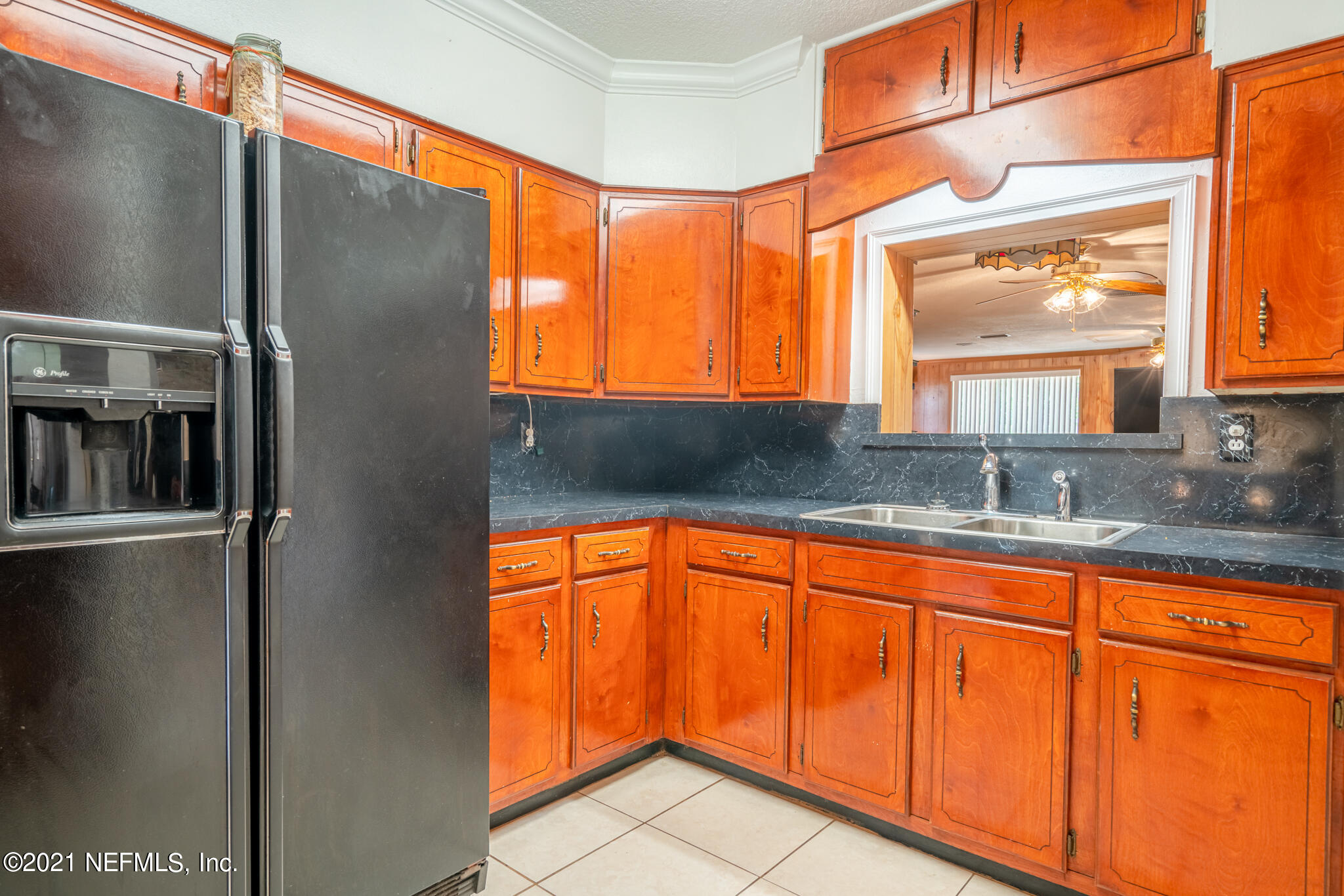 4612 Castleton Drive Jacksonville, FL 32208 - Photo 24 of 41 a kitchen with stainless steel appliances granite countertop a refrigerator and a sink