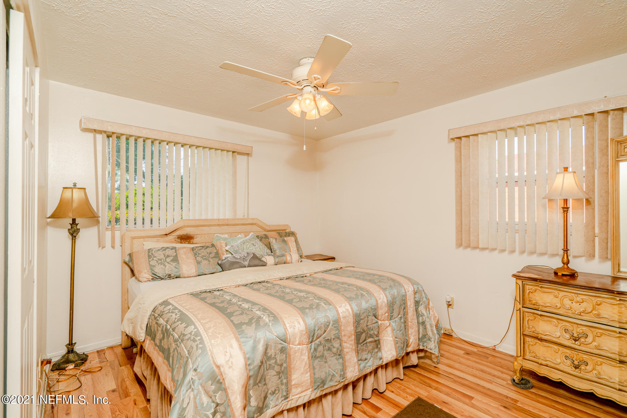 4612 Castleton Drive Jacksonville, FL 32208 - Photo 26 of 41 a bedroom with a bed and wooden floor