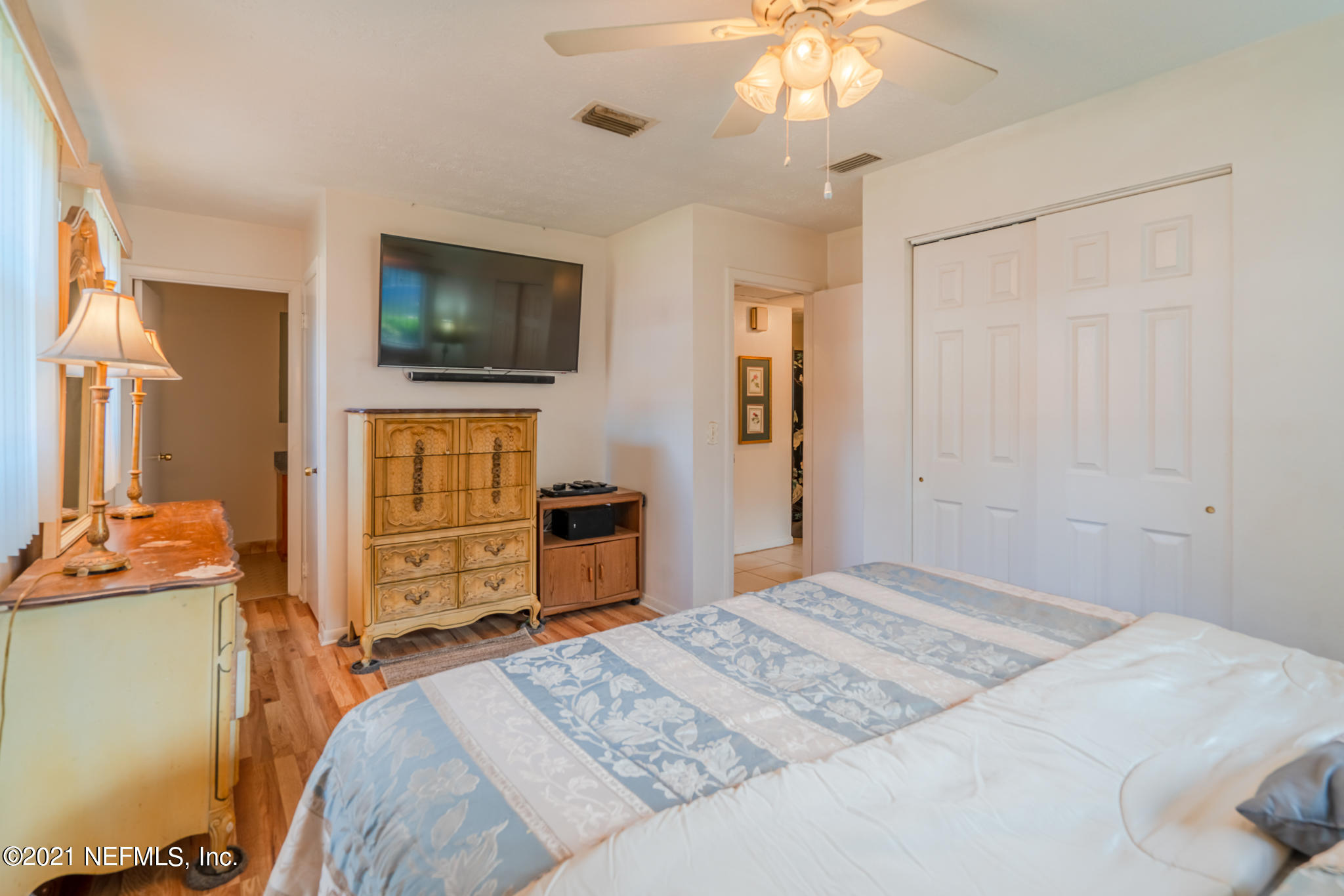 4612 Castleton Drive Jacksonville, FL 32208 - Photo 27 of 41 a bedroom with a bed and a flat screen tv