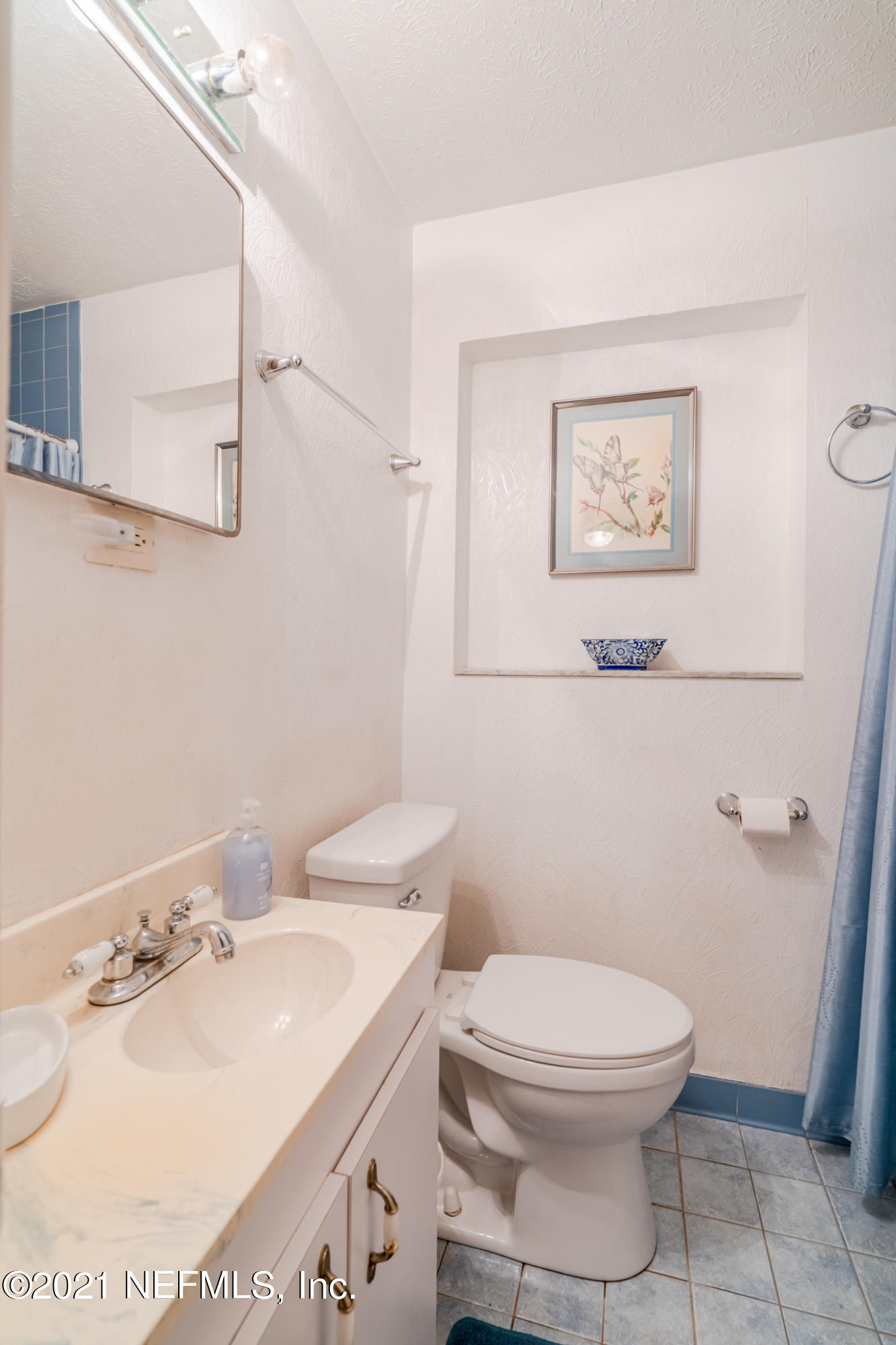 4612 Castleton Drive Jacksonville, FL 32208 - Photo 30 of 41 a bathroom with a sink a toilet and a mirror