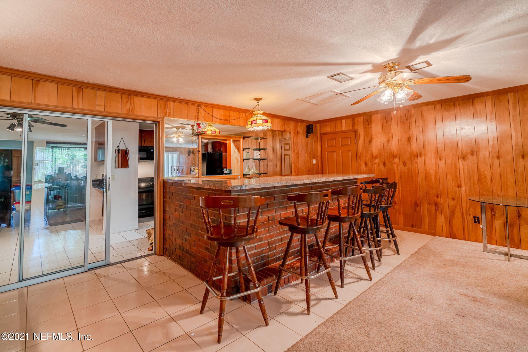 4612 Castleton Drive Jacksonville, FL 32208 - Photo 37 of 41 a view of a dining room with furniture and chandelier
