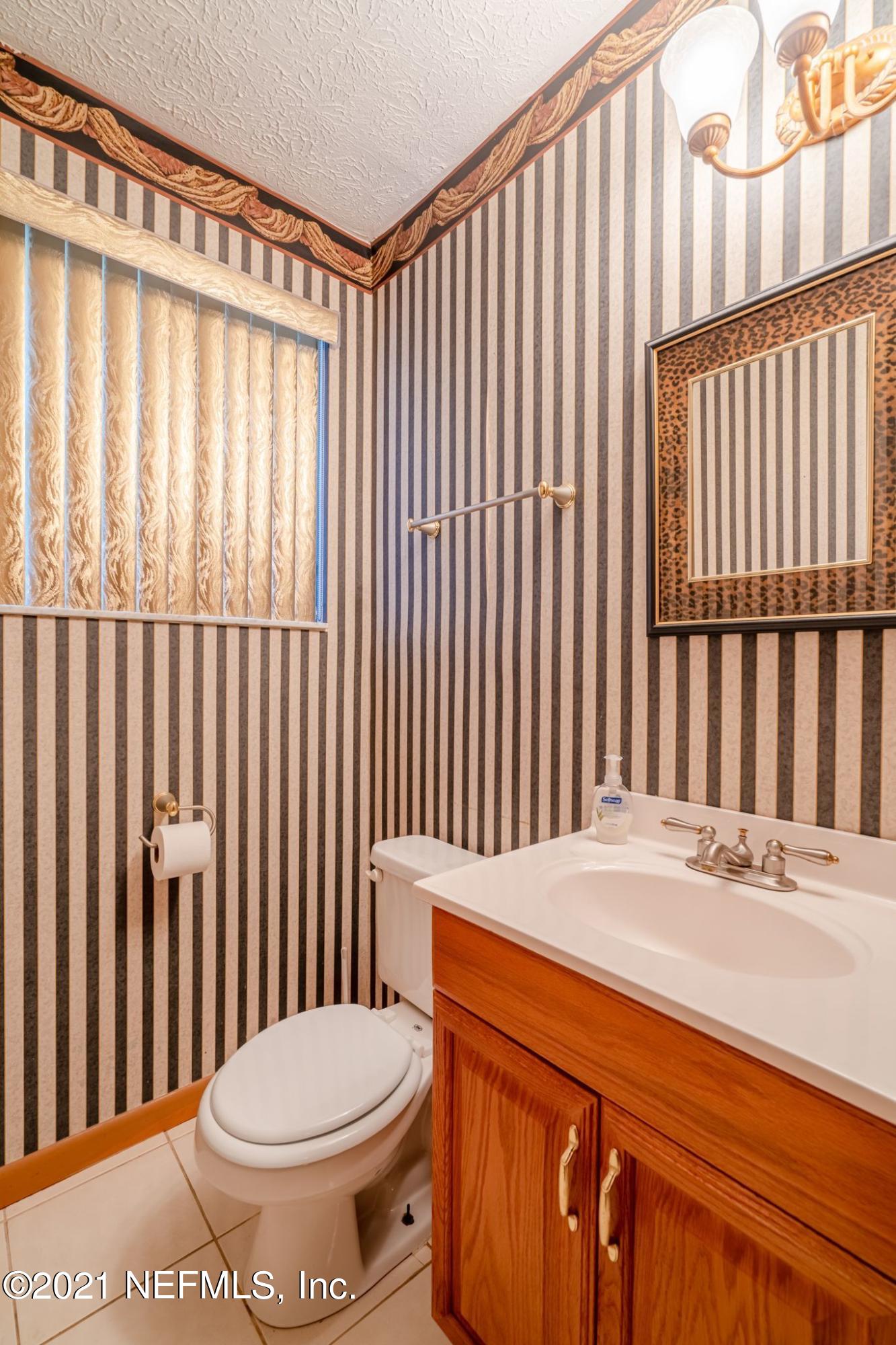 4612 Castleton Drive Jacksonville, FL 32208 - Photo 41 of 41 a bathroom with a toilet and a large window