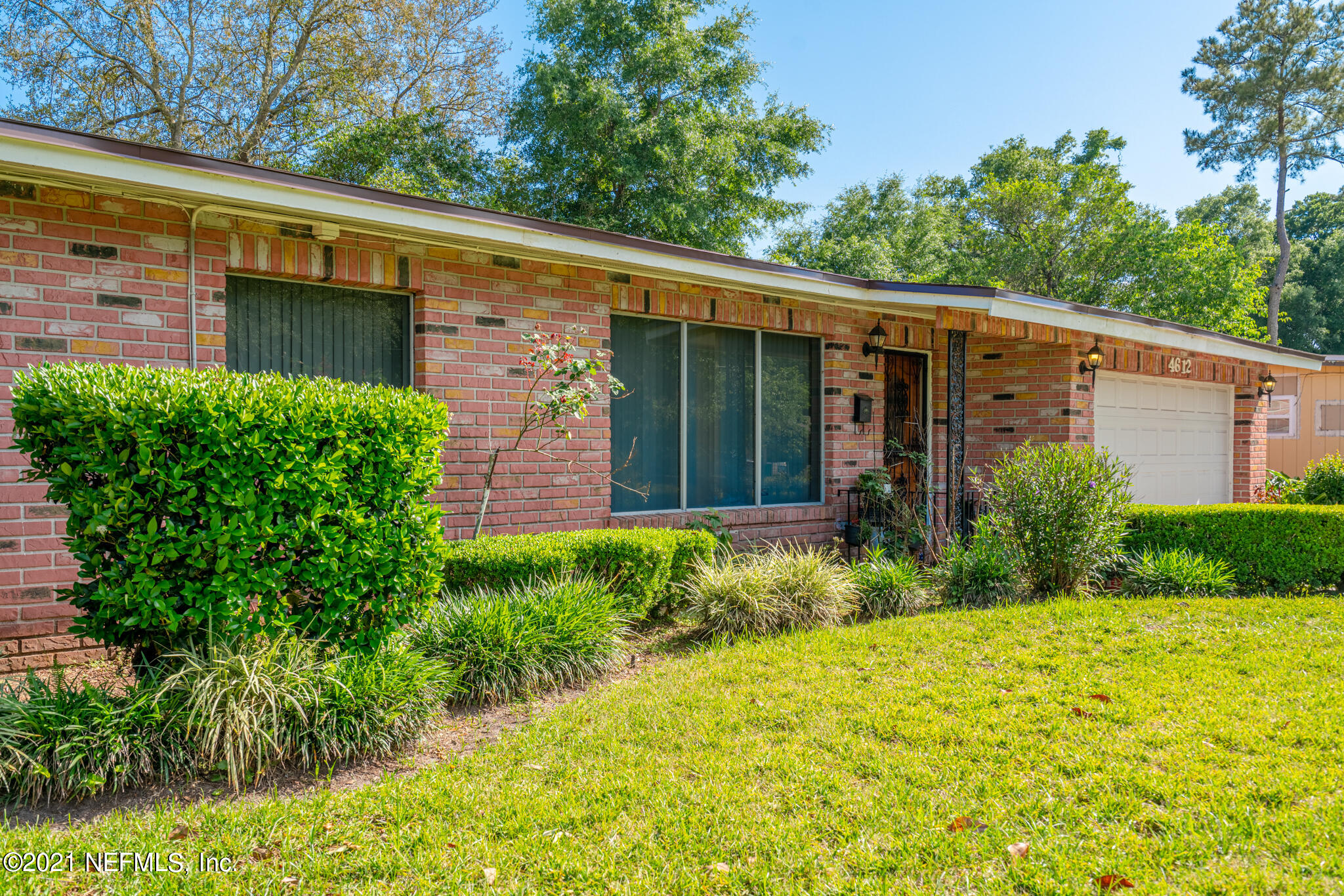 4612 Castleton Drive Jacksonville, FL 32208 - Photo 6 of 41 a front view of a house with garden