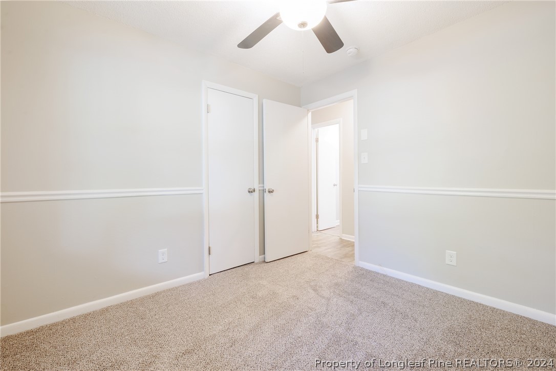 5851 Columbine Road Fayetteville, NC 28306 - Photo 15 of 25 an empty room with an entryway