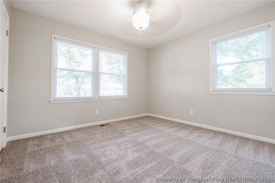 5851 Columbine Road Fayetteville, NC 28306 - Photo 17 of 25 an empty room with a window