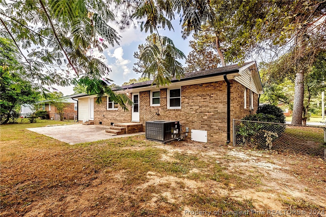5851 Columbine Road Fayetteville, NC 28306 - Photo 22 of 25 a view of a house with back yard