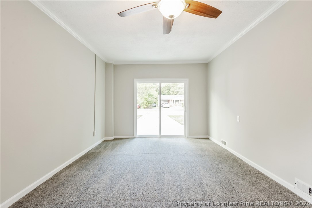 5851 Columbine Road Fayetteville, NC 28306 - Photo 7 of 25 an empty room with windows