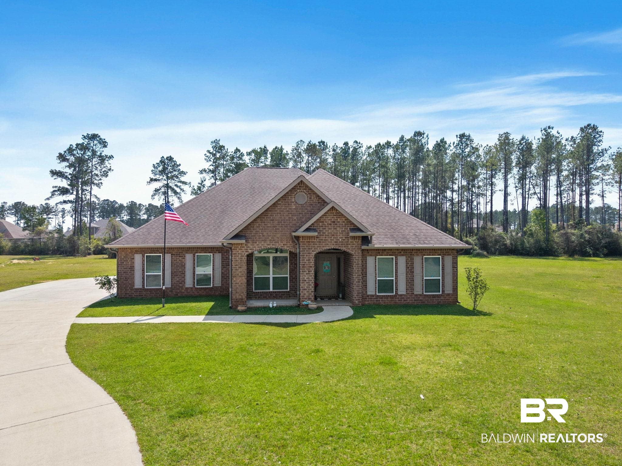 12750 B Jenkins Pit Road Daphne, AL 36527 - Photo 1 of 89 View of front of property featuring a front yard, brick siding, roof with shingles, and driveway