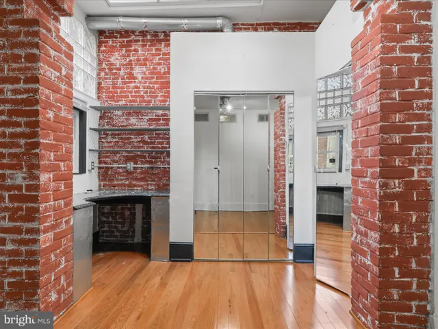 a view of a brick house with an outdoor space