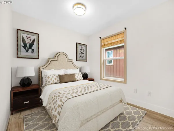 a bedroom with a bed and a window