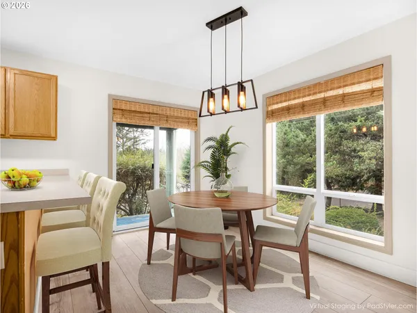 a view of a dining room with furniture window and outside view