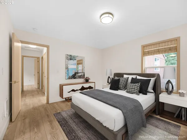 a bedroom with bed and window