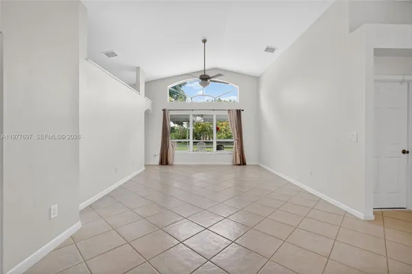 a view of an empty room with a window