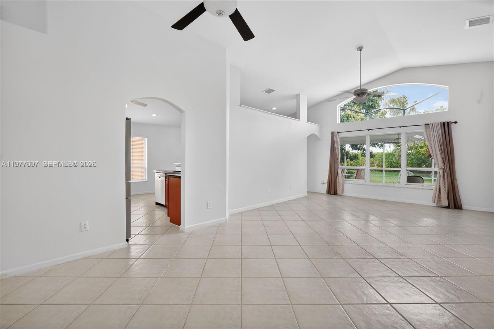 10624 Plainview Circle Boca Raton, FL 33498 - Photo 2 of 49 an empty room with windows and outdoor view