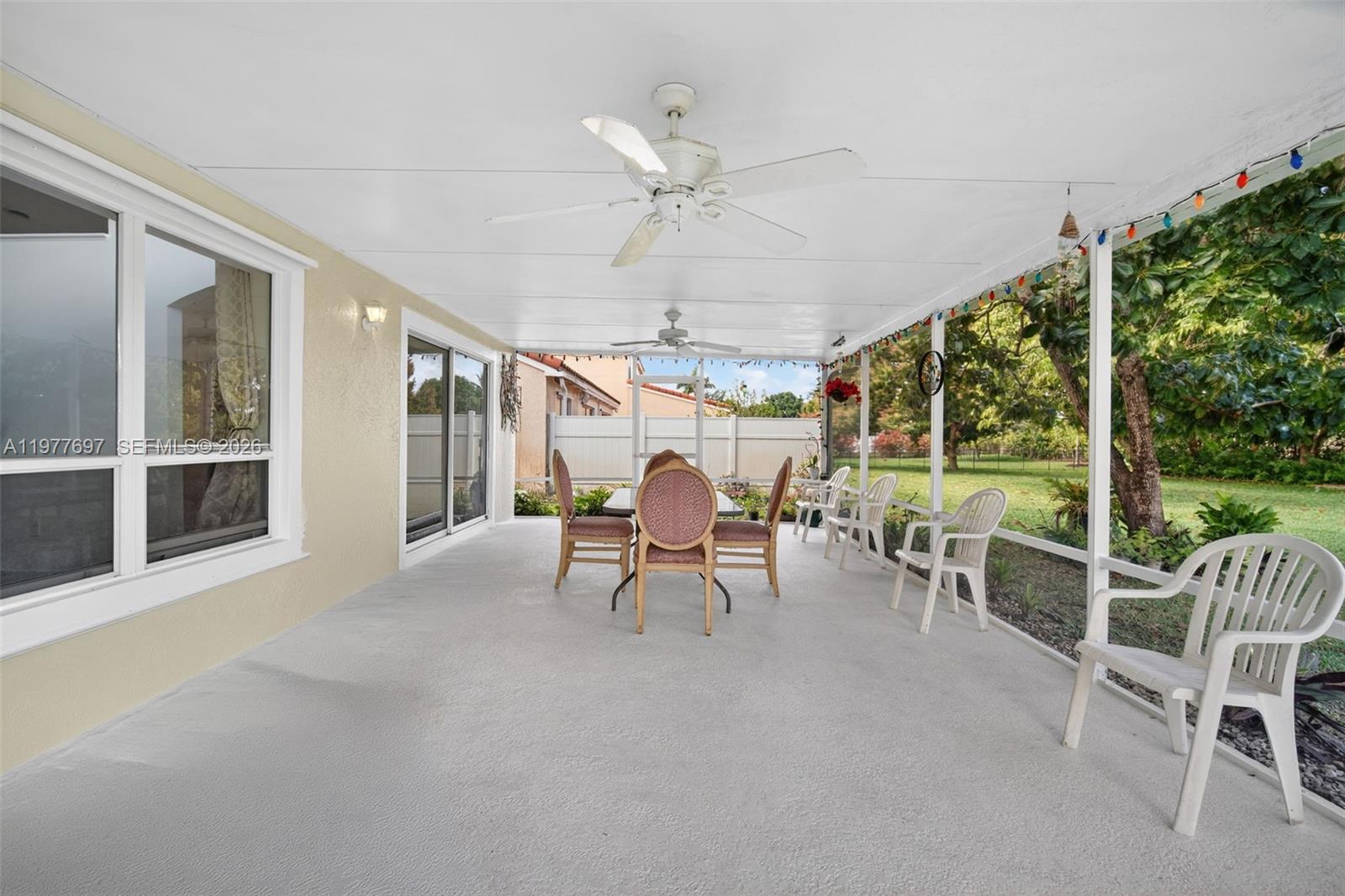 10624 Plainview Circle Boca Raton, FL 33498 - Photo 33 of 49 a living room with furniture and a large window