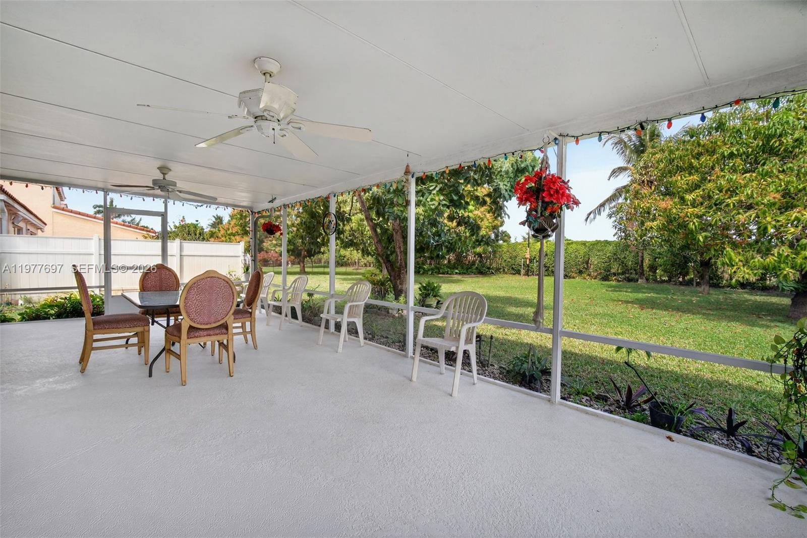 10624 Plainview Circle Boca Raton, FL 33498 - Photo 34 of 49 a living room with furniture and a floor to ceiling window