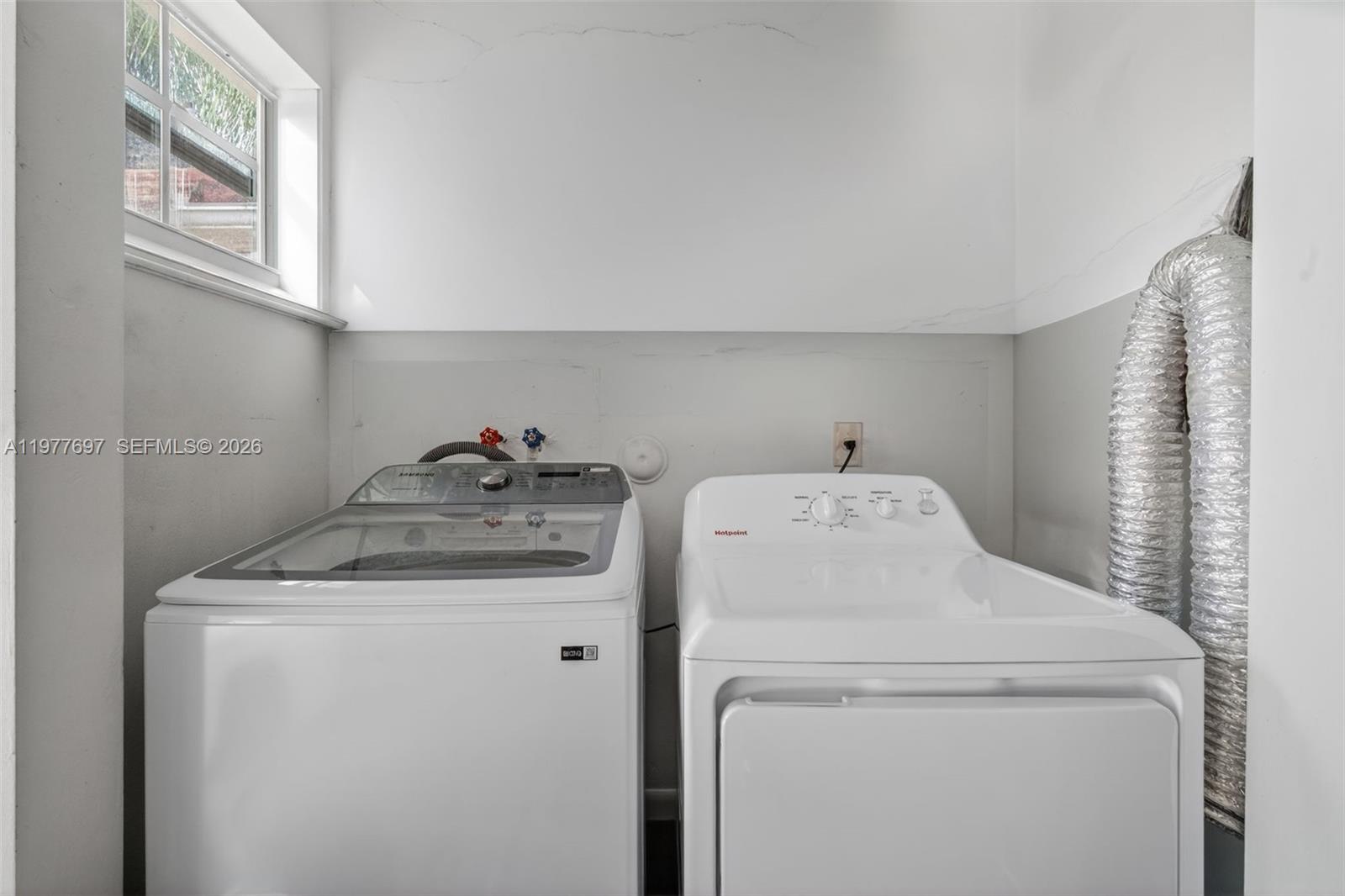 10624 Plainview Circle Boca Raton, FL 33498 - Photo 37 of 49 a utility room with dryer and washer