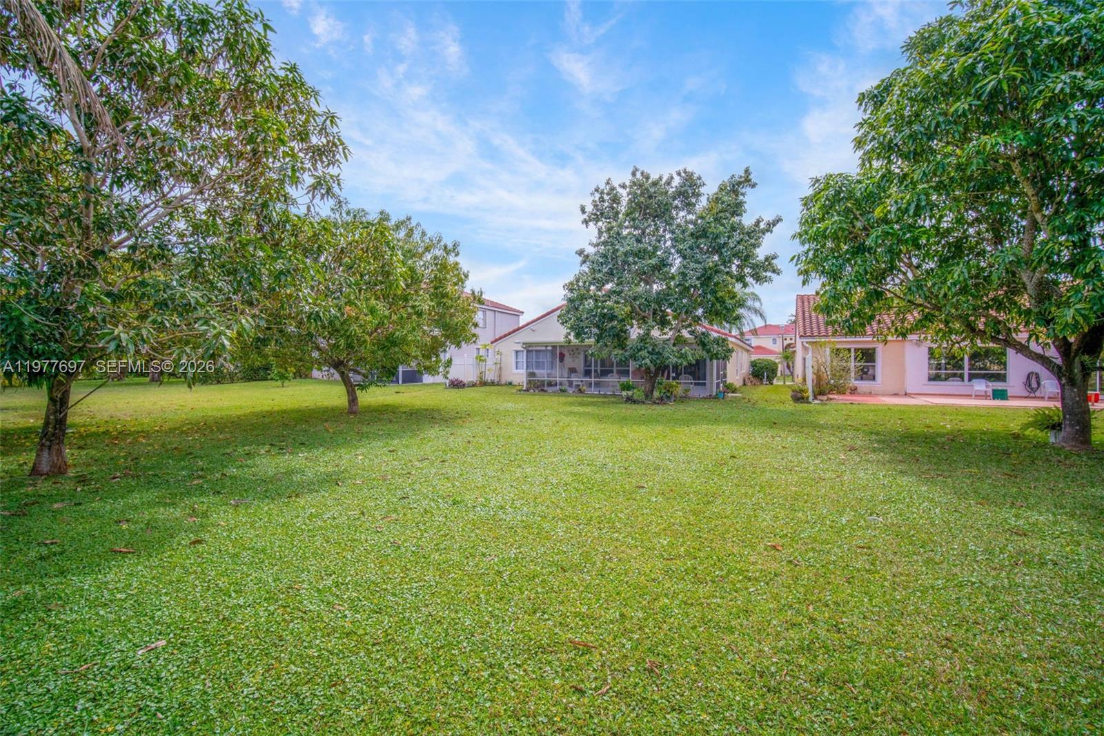 10624 Plainview Circle Boca Raton, FL 33498 - Photo 43 of 49 a view of a house with a yard