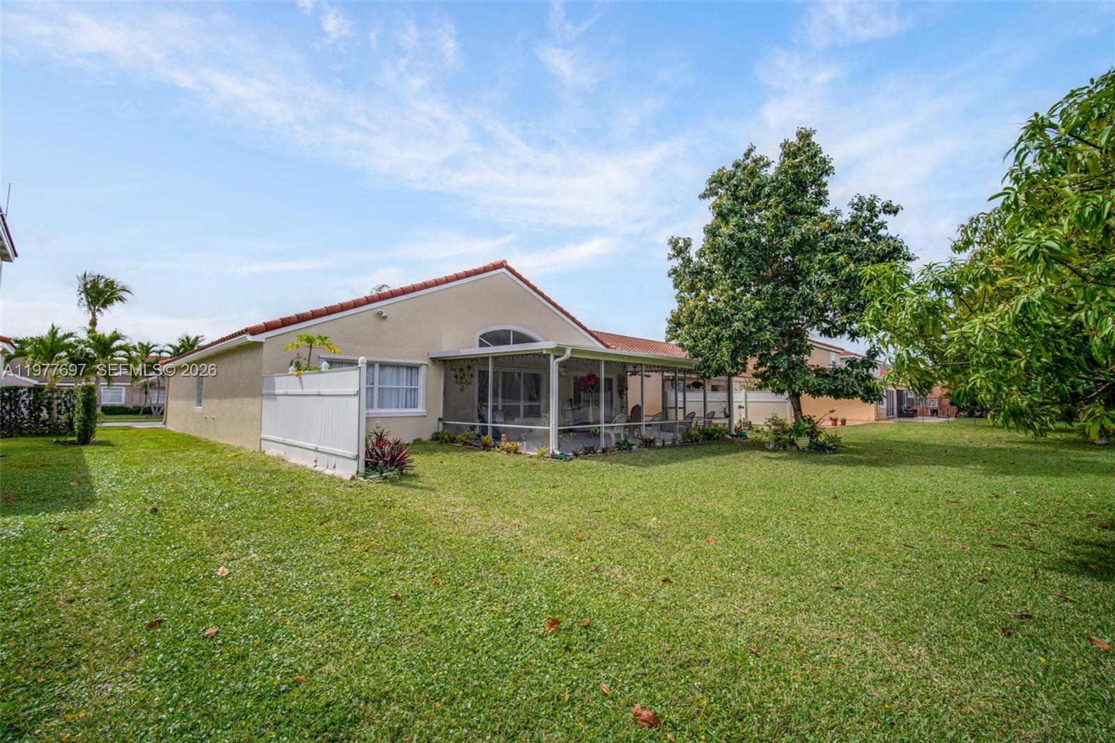 10624 Plainview Circle Boca Raton, FL 33498 - Photo 45 of 49 a front view of a house with garden