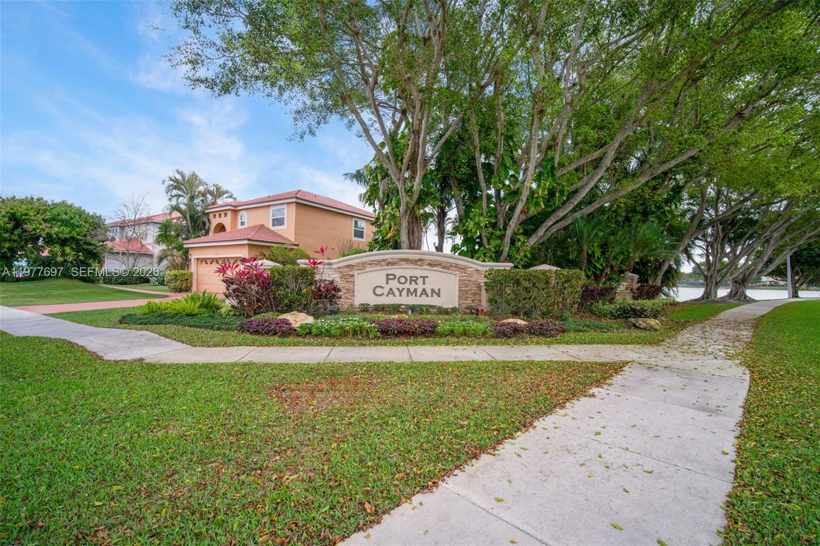10624 Plainview Circle Boca Raton, FL 33498 - Photo 47 of 49 a sign board with a house in the background