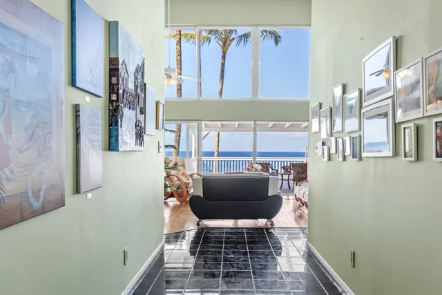 a balcony with furniture and a gate