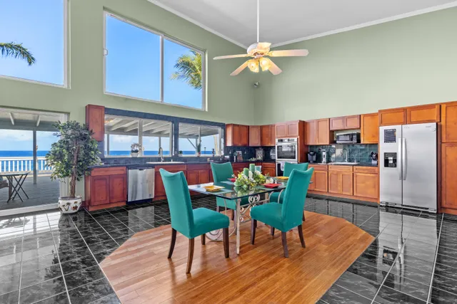 a dining room with furniture a rug and wooden floor