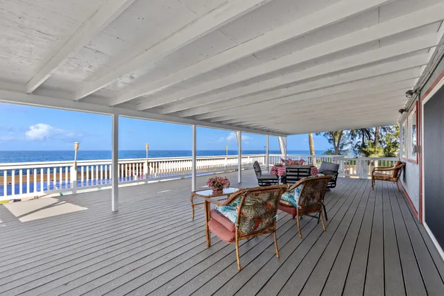 a view of a patio with table and chairs