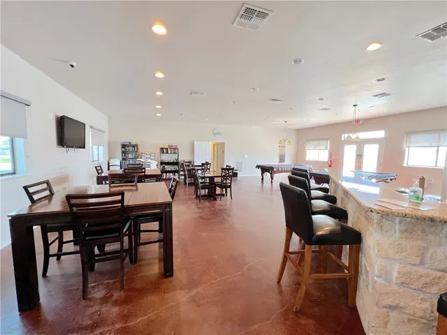 a living room with lots of furniture and a flat screen tv