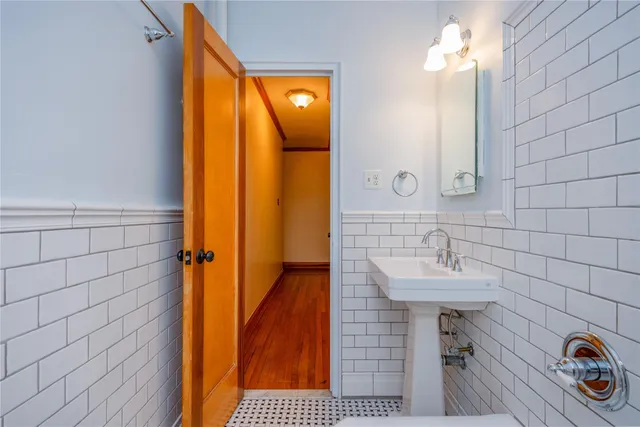 a bathroom with a sink a mirror and shower