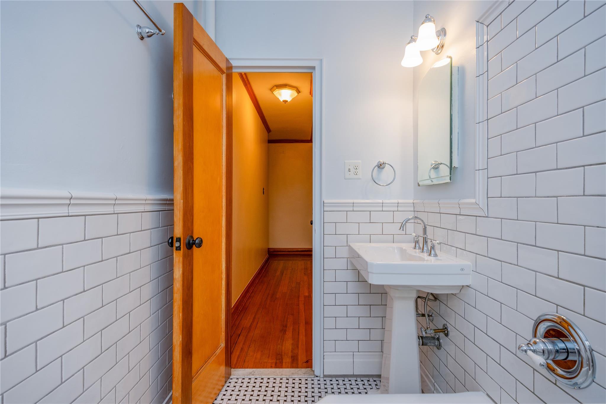 3600 Fieldston Road, Unit 4F Bronx, NY 10463 - Photo 18 of 22 a bathroom with a sink a mirror and shower