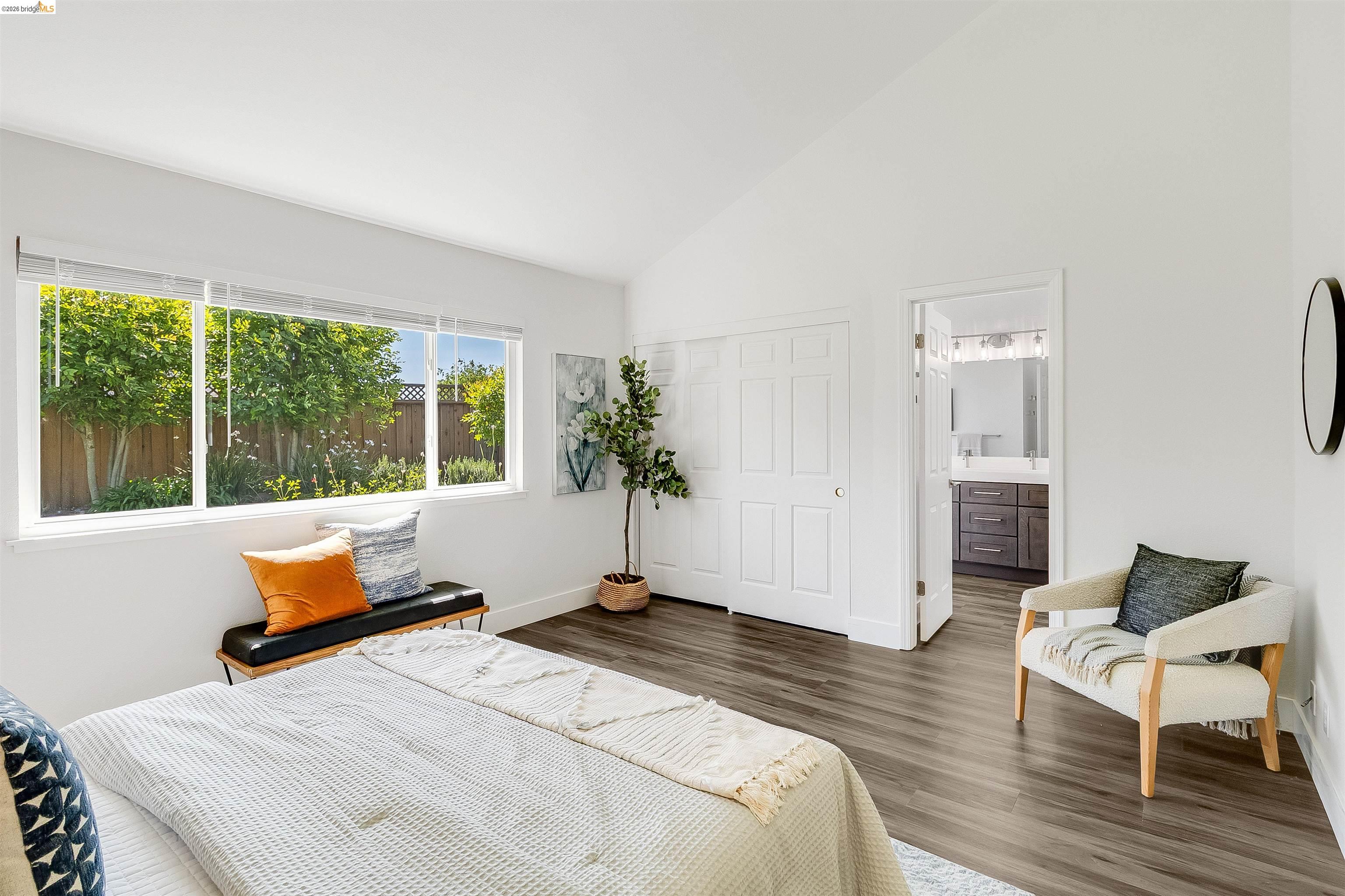 9980 Mangos Drive San Ramon, CA 94583 - Photo 20 of 41 Bedroom featuring lofted ceiling, a closet, dark wood-type flooring, and ensuite bathroom