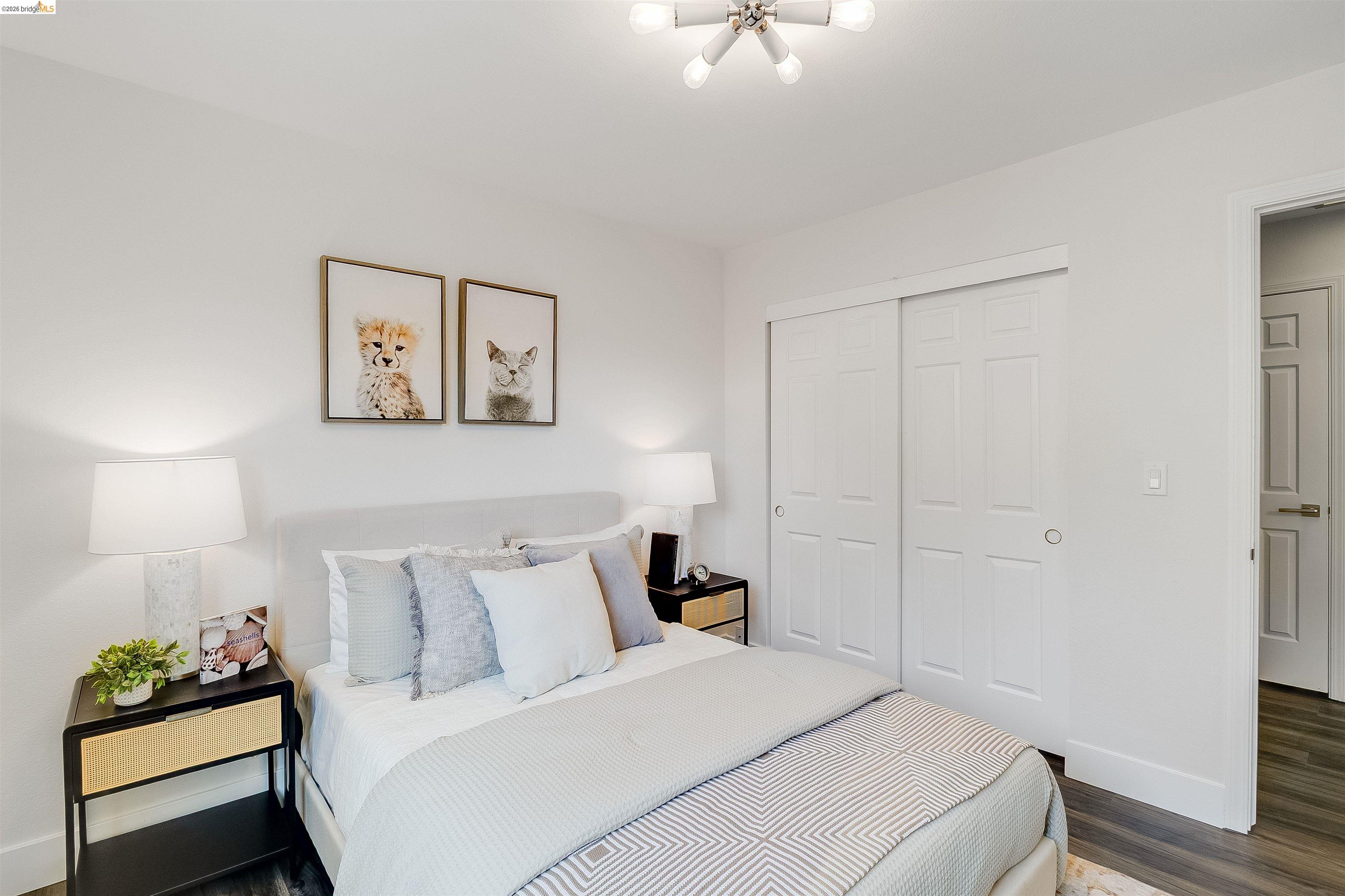 9980 Mangos Drive San Ramon, CA 94583 - Photo 29 of 41 Bedroom with dark wood finished floors, a closet, and hanging lights