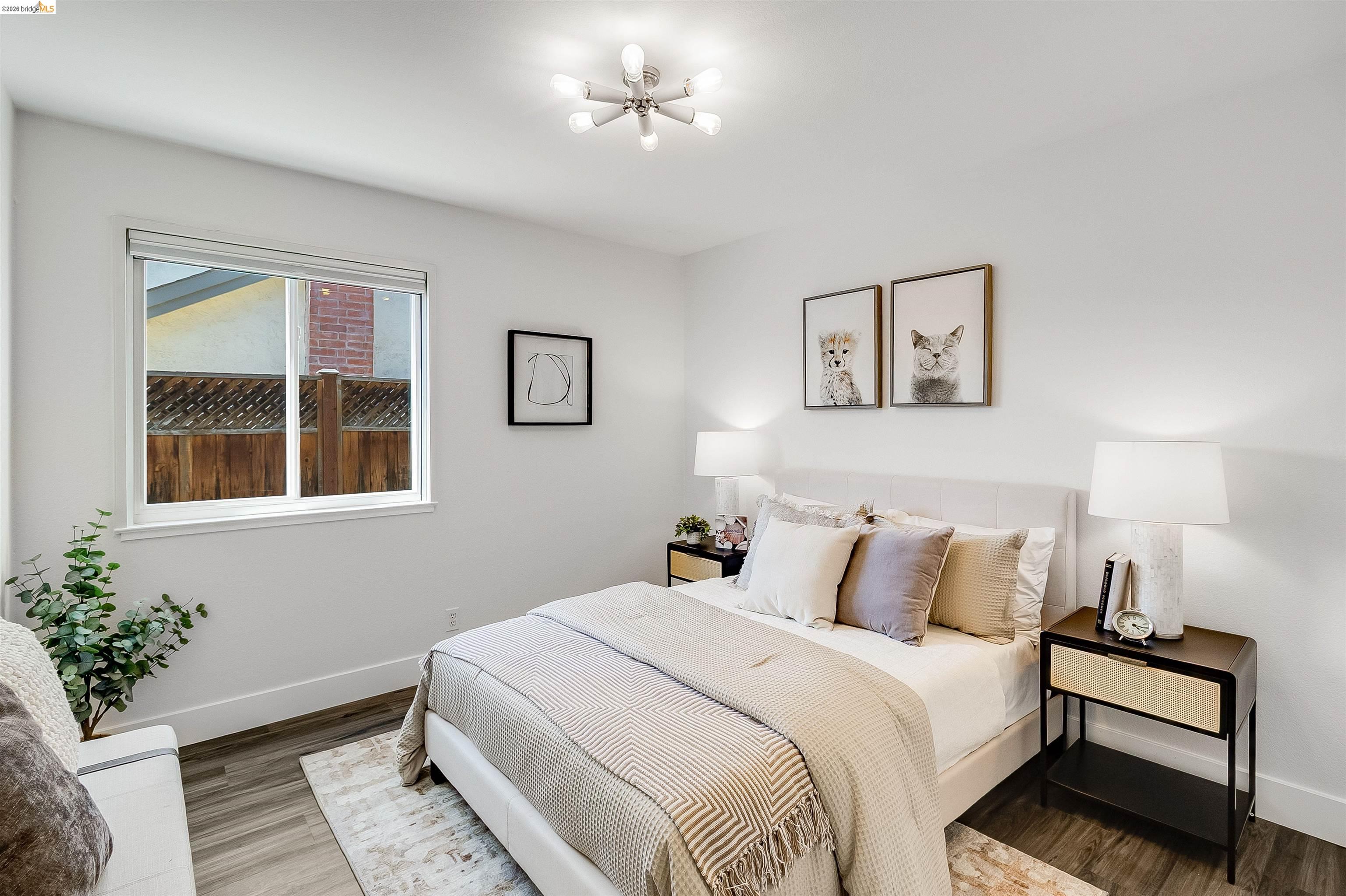 9980 Mangos Drive San Ramon, CA 94583 - Photo 30 of 41 Bedroom featuring wood finished floors and a chandelier