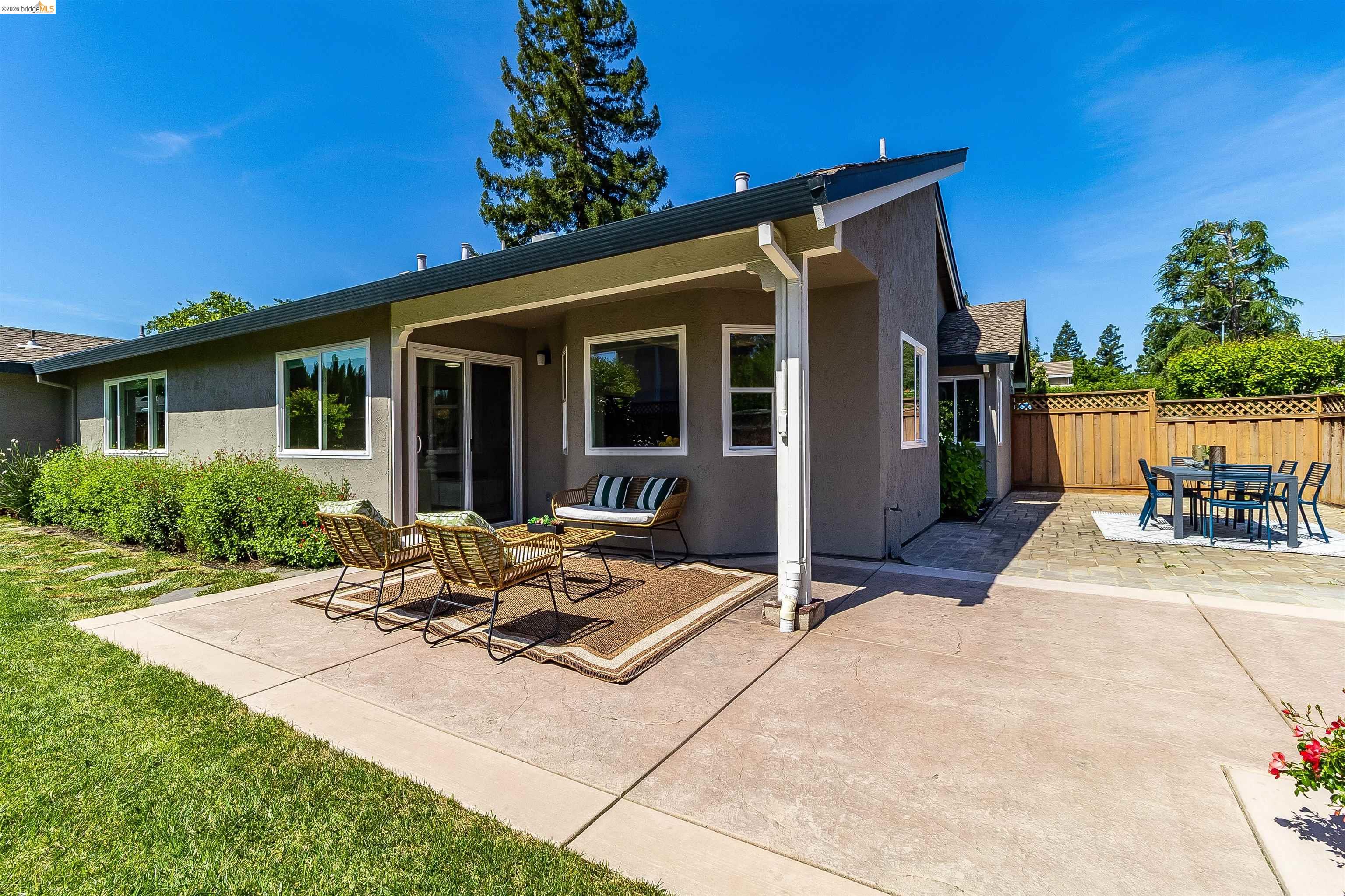 9980 Mangos Drive San Ramon, CA 94583 - Photo 33 of 41 Rear view of house featuring a patio, stucco siding, and outdoor lounge area